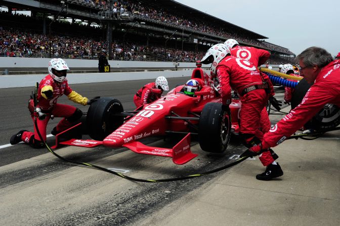 Dario Franchitti's No.10 stops in the pit.