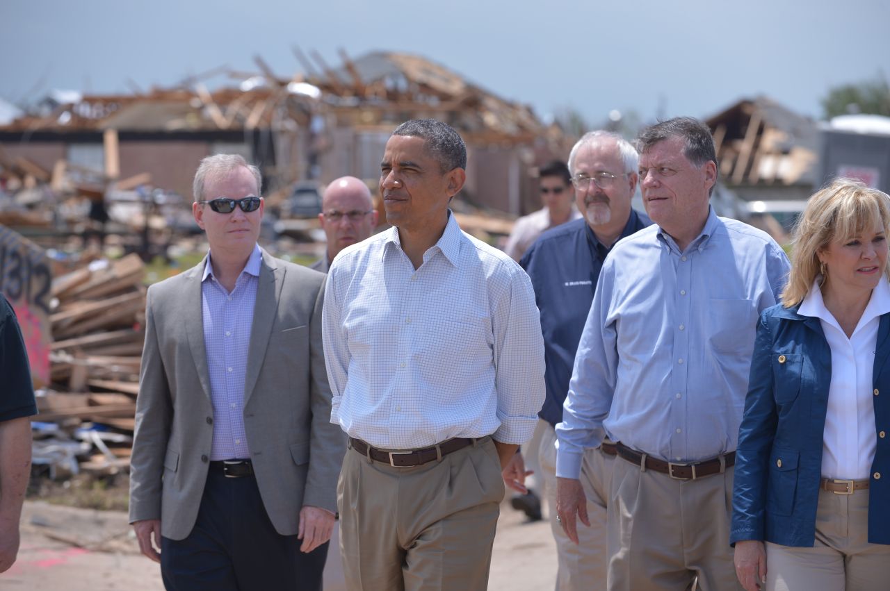 Obama tours a tornado-affected area in Moore, Oklahoma, in May 2013. A tornado that ripped through Moore hit 2,400 homes on a 17-mile path.