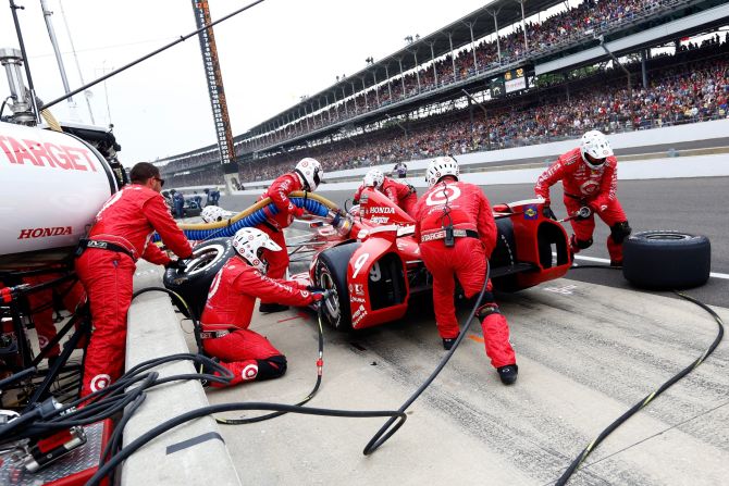 Scott Dixon of New Zealand makes a pit stop in the No. 9 Target Chip Ganassi Racing Honda.