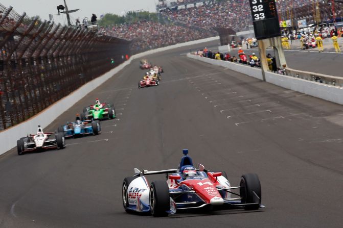 Takuma Sato of Japan, in car No. 14, holds the lead.