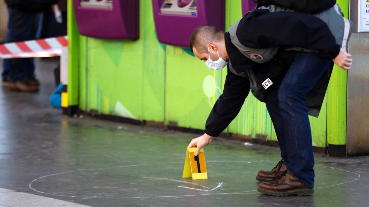 A police investigator works at the site where a man attacked a French soldier patrolling a subway station in Paris.