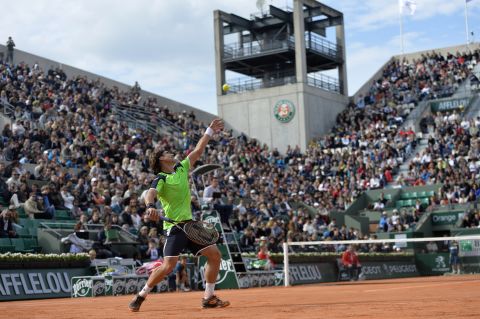 Spain's David Ferrer serves to Australia's Marinko Matosevic during the first round of the French Open on Sunday, May 26, in Paris. Ferrer won the match 6-4, 6-3, 6-4. 