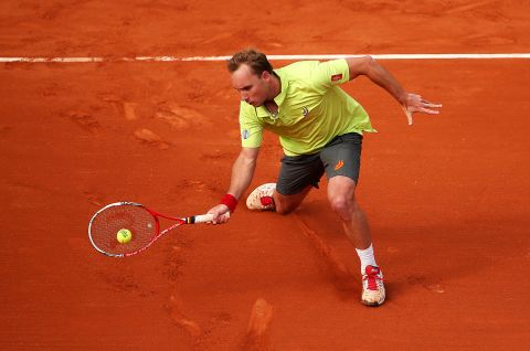 Darcis makes a forehand swing against Llodra  on May 26.  