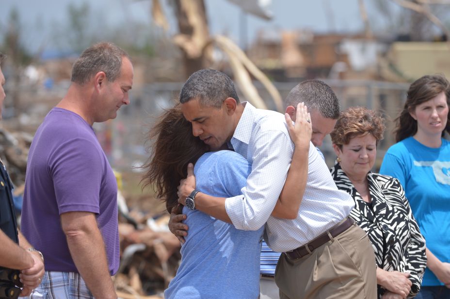 President Barack Obama is greeted as he tours the tornado-ravaged area near Moore, Oklahoma, on Sunday, May 26. 