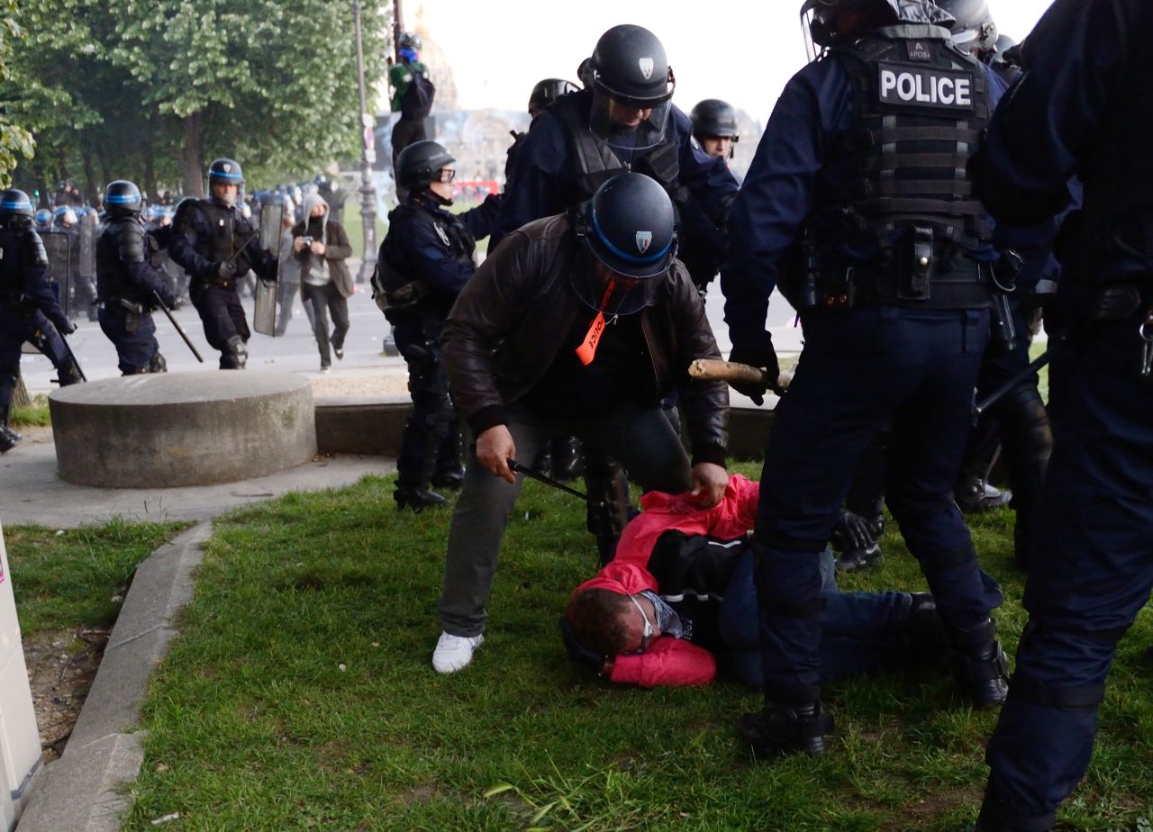 Riot police arrest a protester on May 26.