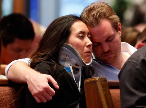 Plaza Towers Elementary School teacher Jennifer Doan is comforted by her fiance, Nyle Rogers, on May 26. 