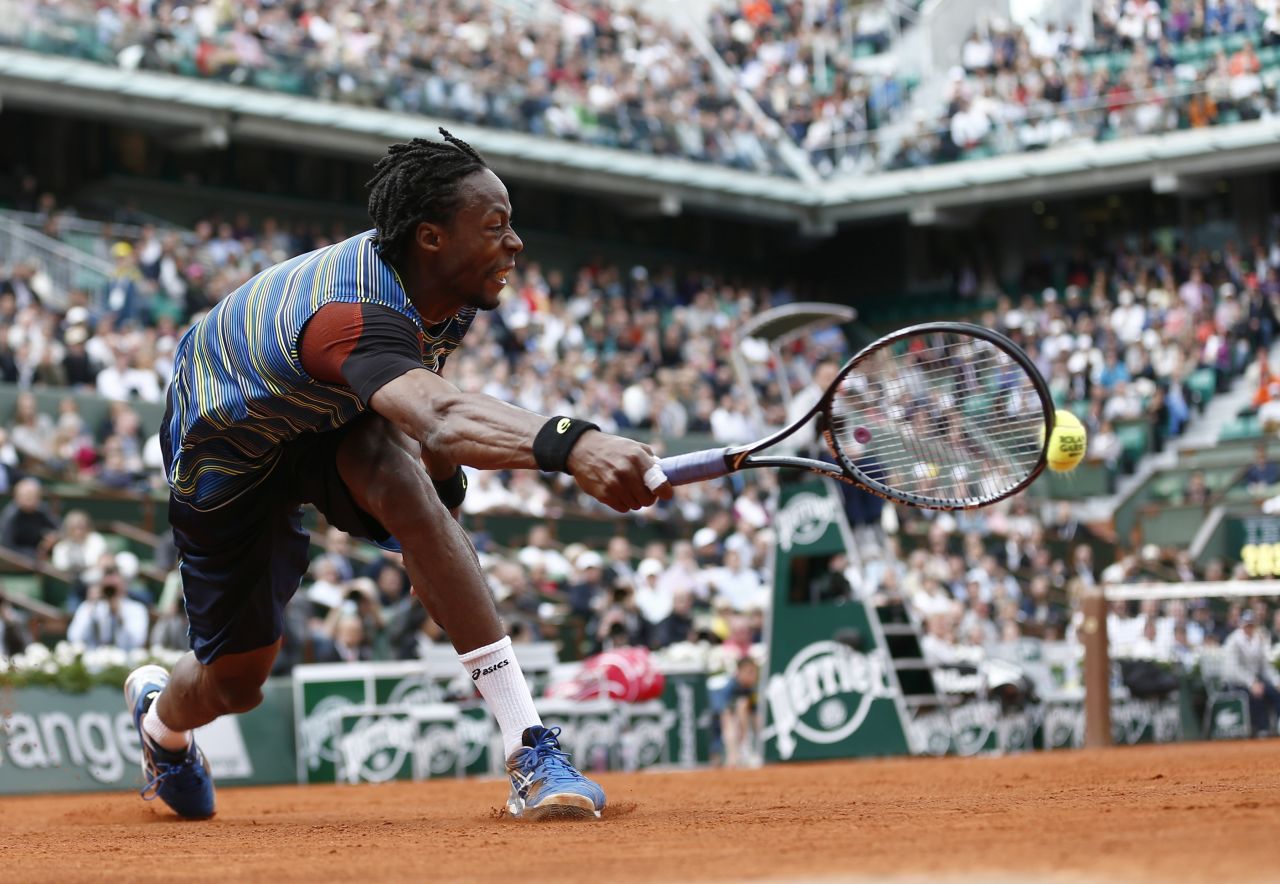 France's Gael Monfils stretches for a shot against Czech Republic's Tomas Berdych during the first round of the French Open on Monday, May 27, at the Roland Garros stadium in Paris. Monfils defeated Berdych 7-6(8), 6-4, 6-7(3), 6-7(4), 7-5.