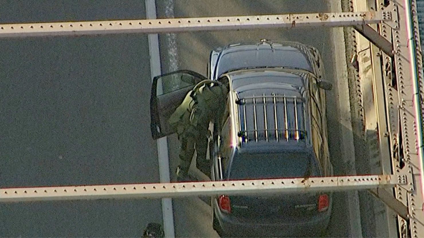 A member of the bomb squad searches the suspicious vehicle on the Brooklyn Bridge on Monday.