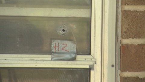 A bullet hole is left in a window after a shooting spree in Texas.