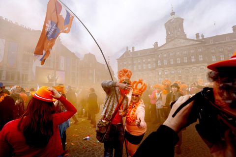 Dutch celebrating the investiture of the country's new king in Amsterdam on April 30.