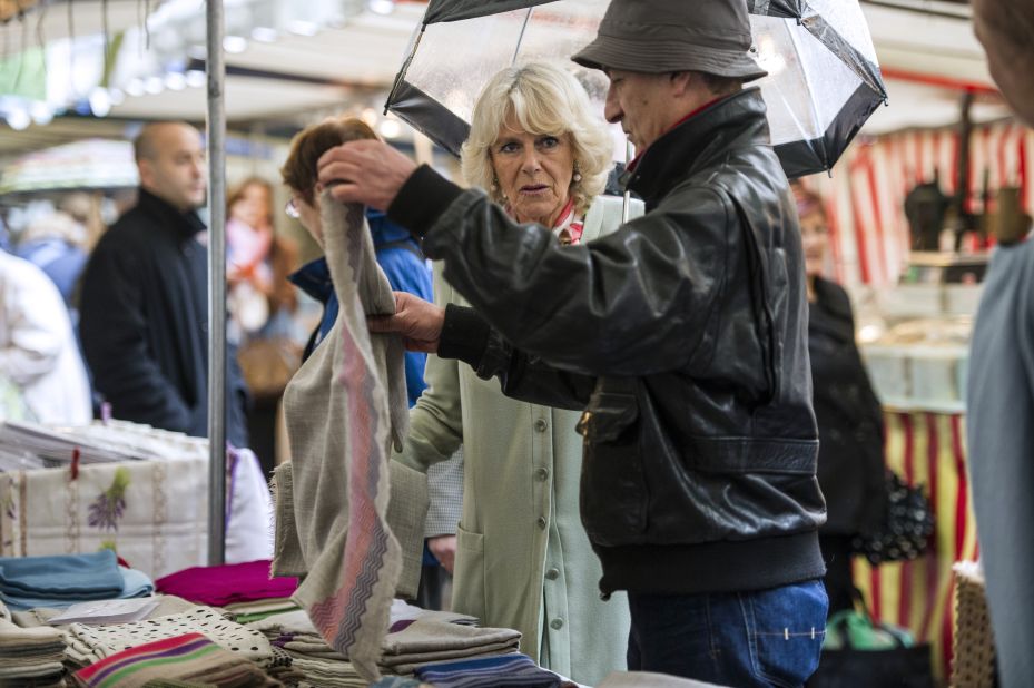 Camilla makes an unannounced visit to a street market and talks with the vendors.