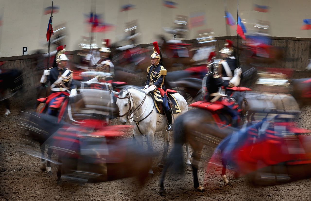 Members of la Garde républicaine perform for Camilla at their headquarters.