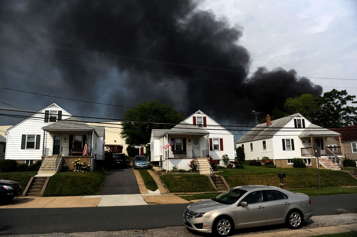 Smoke billows from a train derailment that caused a major explosion in the Rosedale neighborhood outside of Baltimore on Tuesday, May 28. A CSX freight train collided with a commercial truck and derailed leading to an explosion that a witness said could be felt blocks away.