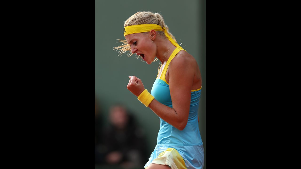 Kristina Mladenovic of France celebrates a point in her women's singles match against Lauren Davis of the United States on May 28. Mladenovic won 6-0, 7-5.