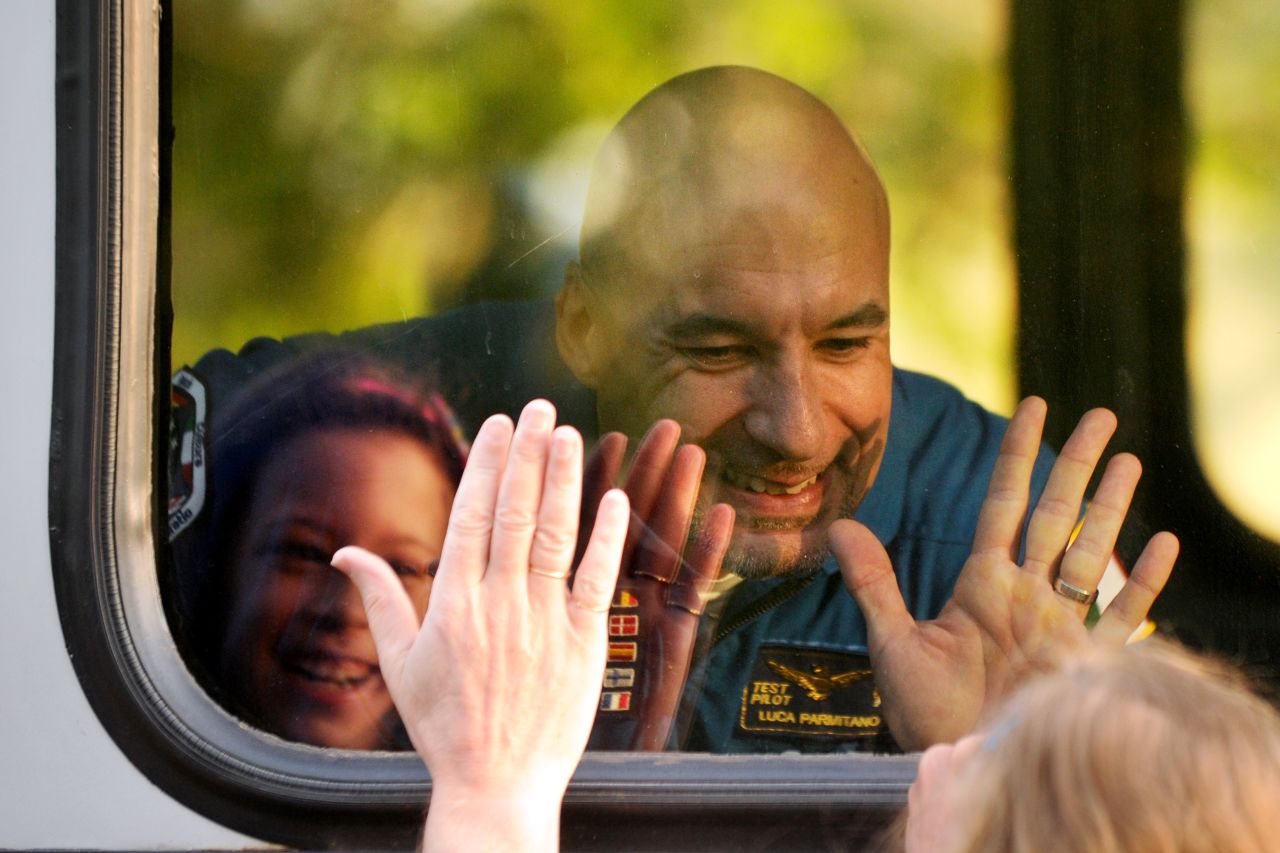 Parmitano gestures at relatives on May 28 during a sending-off ceremony.