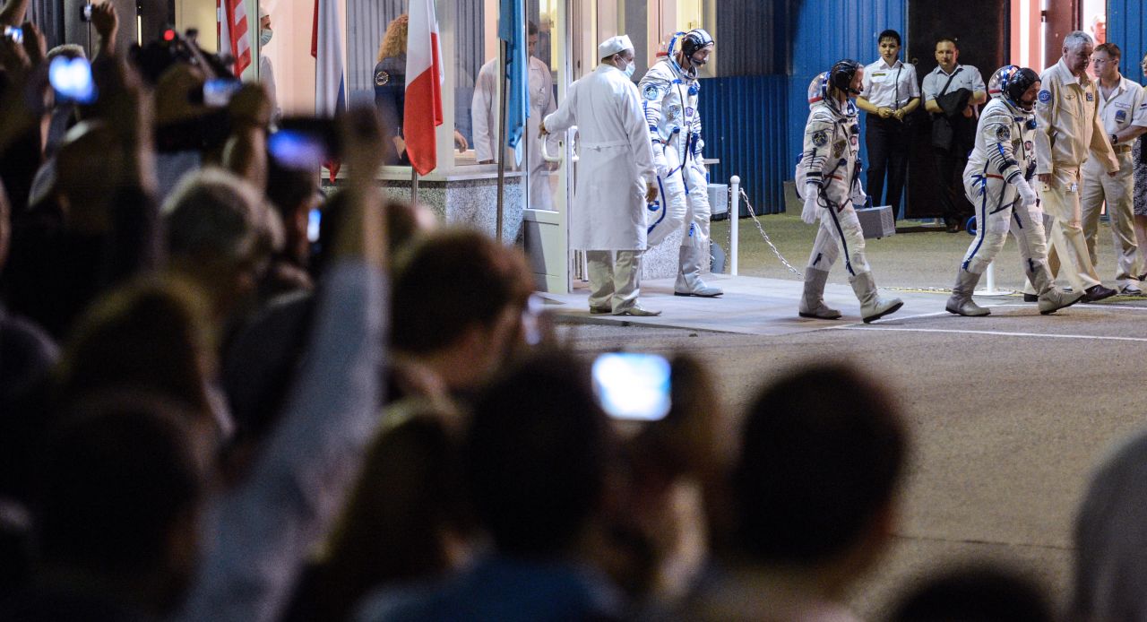 Nyberg, Yurchikhin and Parmitano walk from their hotel to a bus during a sending-off ceremony on Tuesday, May 28.