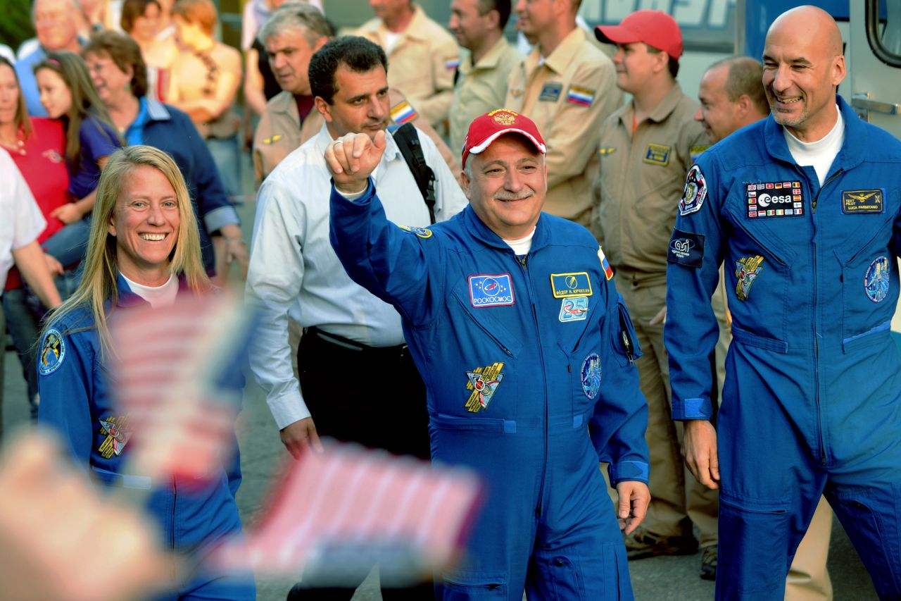 Nyberg, Yurchikhin and Parmitano wave to their families during a send off on May 28.