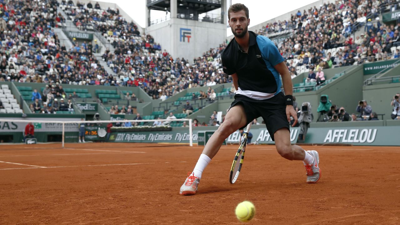 France's Benoit Paire misses a shot from Cyprus' Marcos Baghdatis on May 29. Paire defeated Baghdatis 3-6, 7-6(1), 6-4, 6-4.