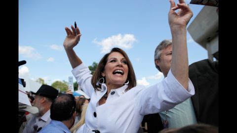 Bachmann encourages people to vote for her in an August 2011 appearance outside the Hilton Coliseum at Iowa State University in Ames, Iowa. Her presidential campaign reached its peak that month when she beat out a slate of other candidates to win the Ames Straw Poll in Iowa.