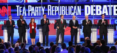 From left, Republican presidential candidates Herman Cain, Bachmann, Mitt Romney, Texas Gov. Rick Perry, Rep. Ron Paul, former House Speaker Newt Gingrich and Rick Santorum participate in a September 2011 presidential debate sponsored by CNN and the Tea Party Express in Tampa, Florida. 
