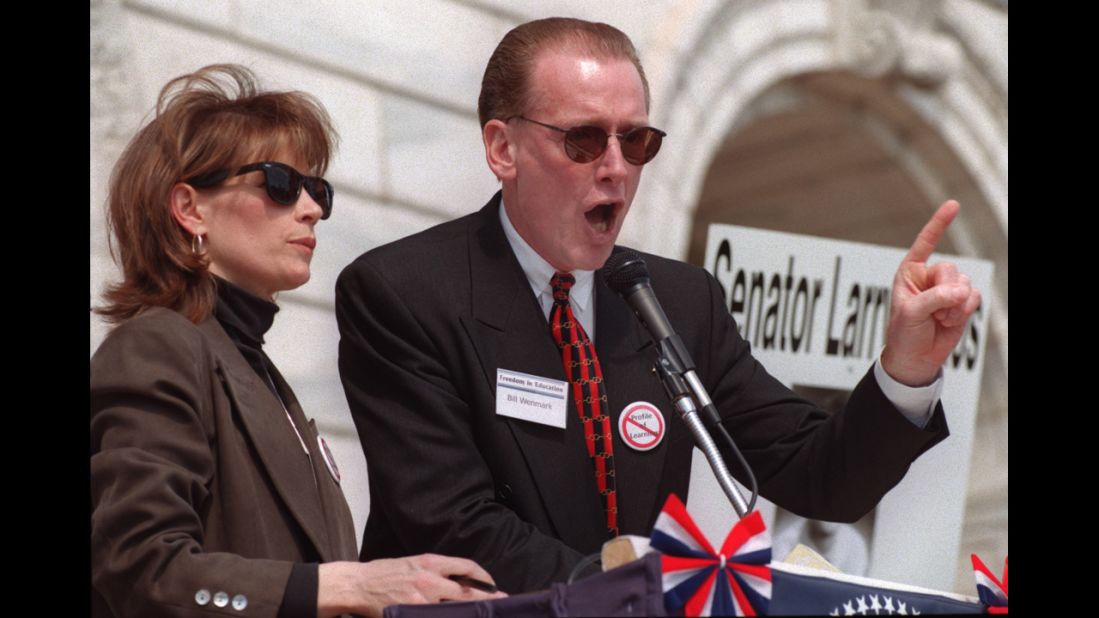 Bachmann and Bill Wenmark address a crowd on the steps of the Minnesota state Capitol in St. Paul in April 1999.  