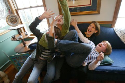 Bachmann plays with daughters, from left, Caroline, Elisa and Sophia at their home in Stillwater, Minnesota, in December 2004.