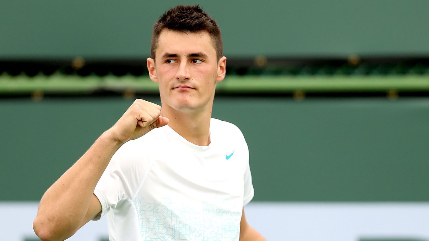 Tomic says his Dad is continuing to coach him and travel with him to tournaments despite assault charges.