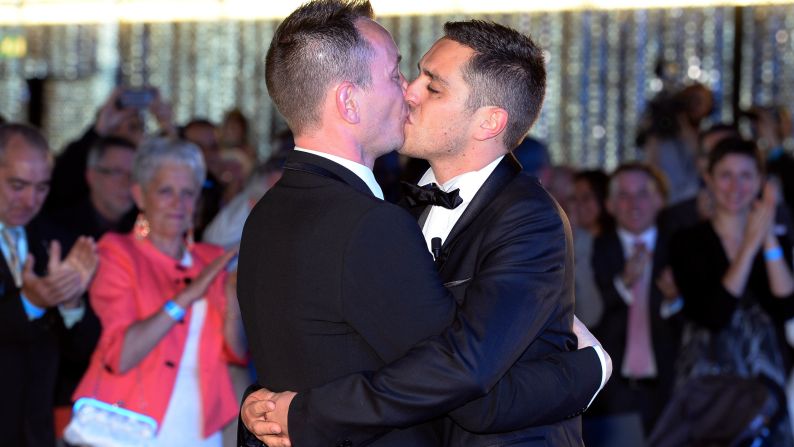 Vincent Autin, left, and Bruno Boileau kiss as they exchange marriage vows at City Hall in Montpellier, France, on Wednesday, May 29. The two men were the <a >first gays to wed in France</a> after the passage of a law allowing same-sex couples to marry and adopt children. The legislation has prompted fierce opposition from many social conservatives and the Catholic Church.