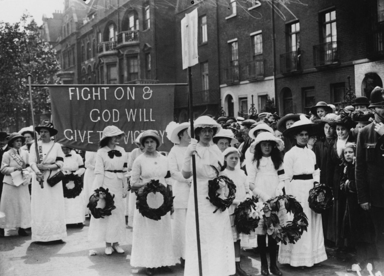 The Suffragettes -- who campaigned for womens' right to vote -- had a distinctive style, pictured here wearing white flowing dresses and black arm bands at Davison's funeral procession. They wore purple, white and green sashes -- purple symbolized dignity, white represented purity, and green stood for hope.