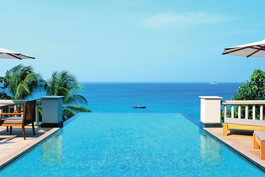 At Trisara, all-glass French doors open onto a 32-foot-long cerulean plunge pool that appears to drip into the Andaman Sea.