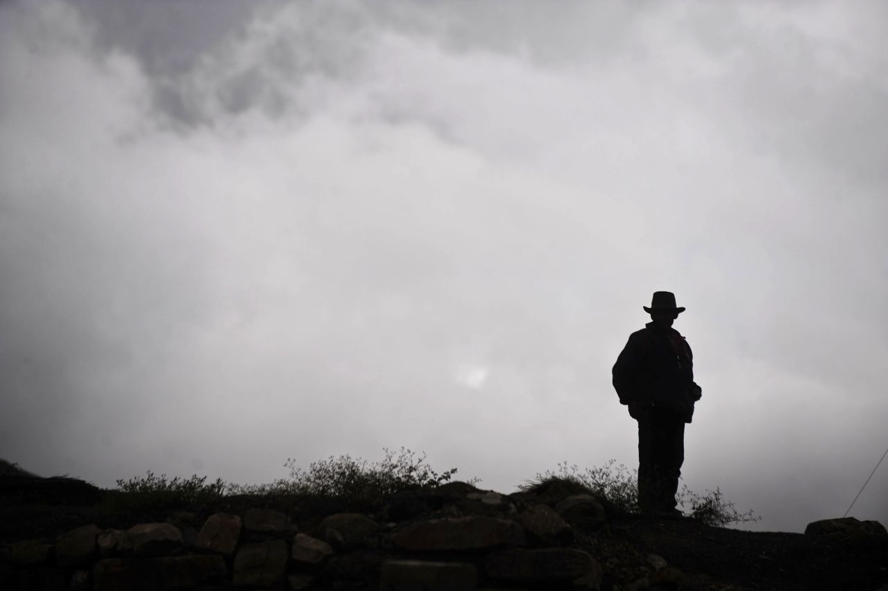 A man stands on a hill at the ancient Chavin archaeological site in Peru in October 2011.