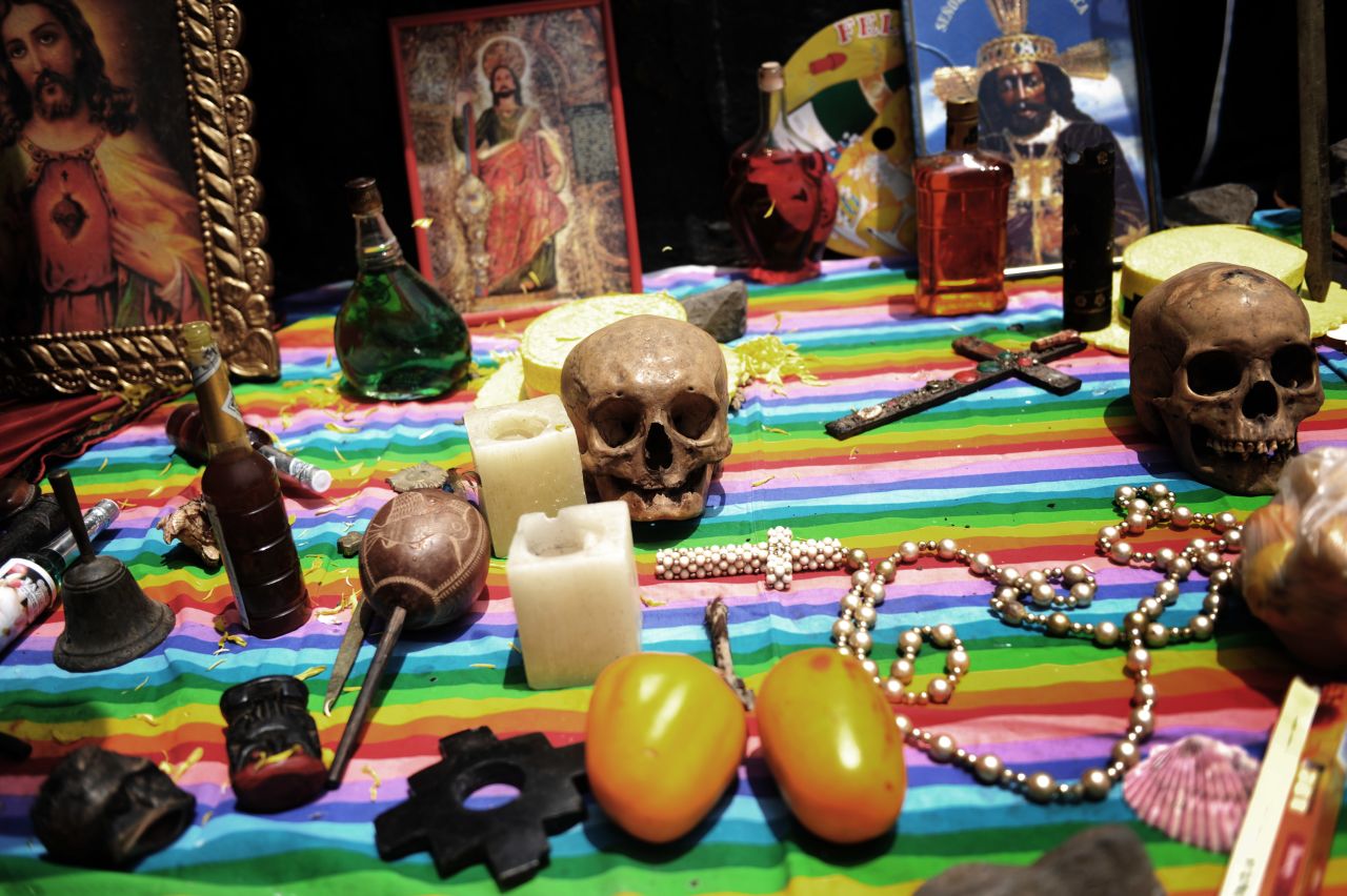 Items are laid out on a table while shamans practice a ritual of making predictions for the new year at San Cristobal Hill in Lima in December 2009.