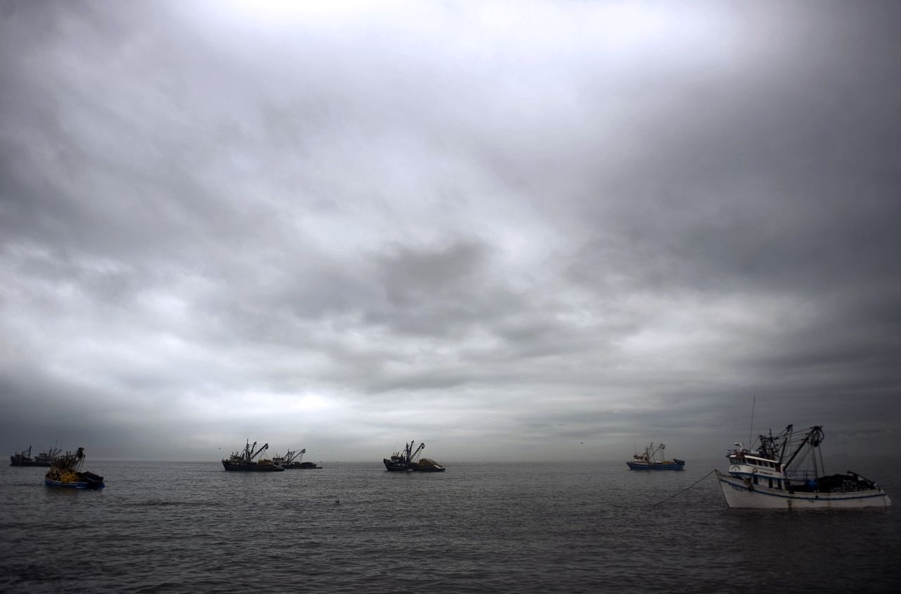 Fishing boats anchor off the coast of Lima.
