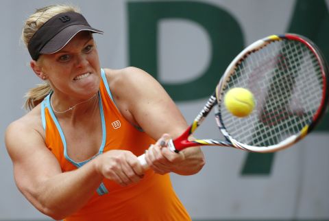 Melanie Oudin of the United States hits a backhand to China's Jie Zheng on May 30.