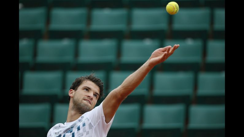 Bulgaria's Grigor Dimitrov serves to France's Lucas Pouille on May 30.