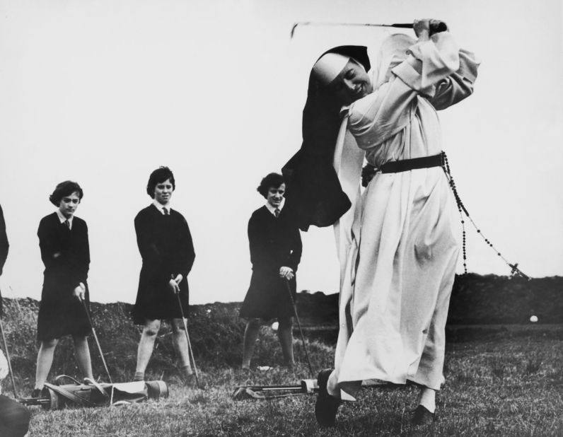 Nun and golf coach, Sister Mary Martina was a regular on the course. Here she shows students how to take an iron shot while on the golf course at Rosebud Country Club, Portsea, Victoria, Australia back in in 1965.