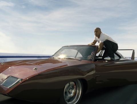 The good guys never, ever fall off that fast-moving car. They will hold on by their fingertips, hold on with one hand or even leap from said vehicle. But, like Vin Diesel here in "Fast and Furious 6," they always stay perfectly perched.
