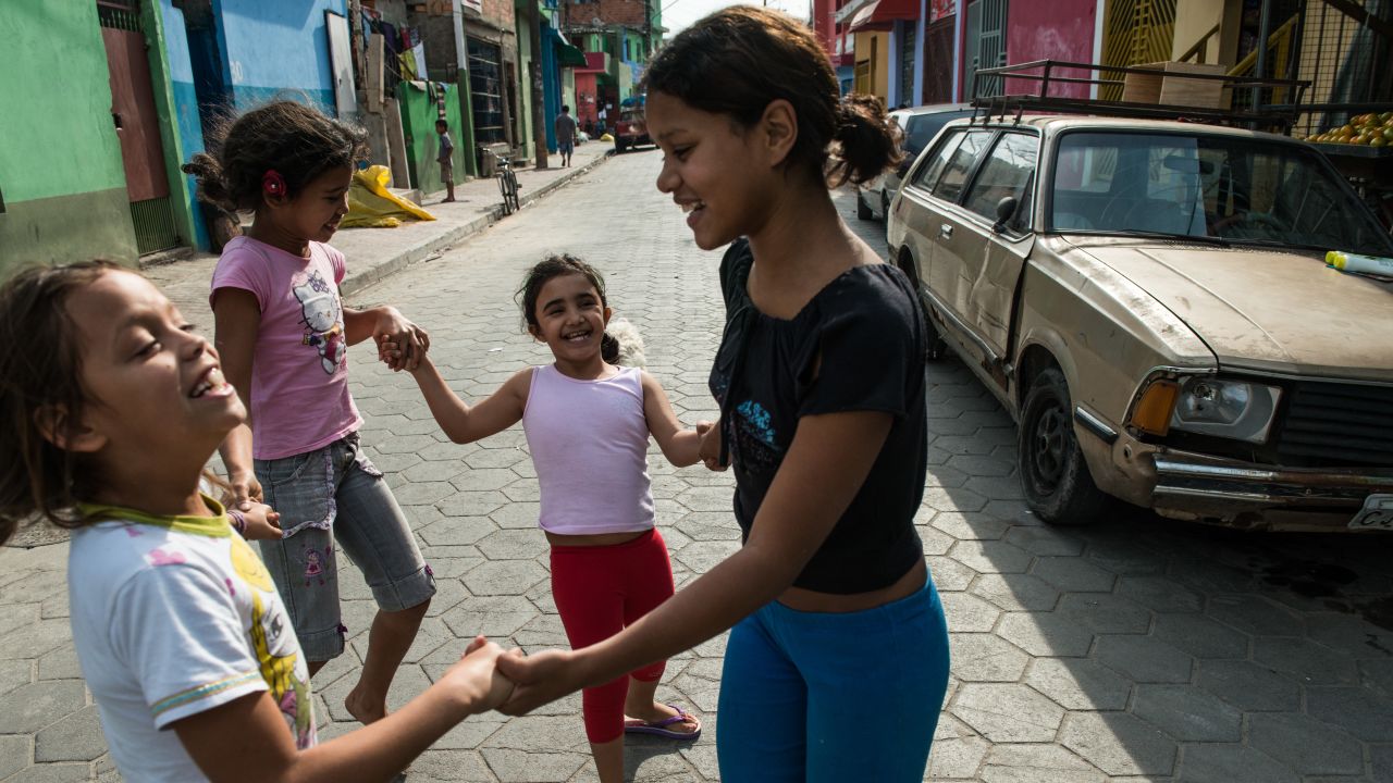 Girls play in a paved street in Uniao de Vila Nova, recently converted in the framework of a favela upgrading project 