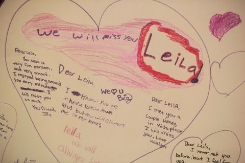 People leave notes at the memorial for Leila.