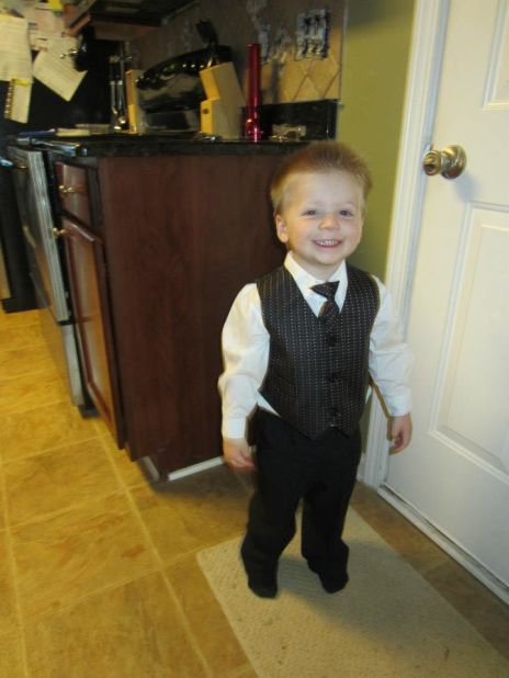 One week before the accident in late October, Tripp stands tall in his new suit and tie. 