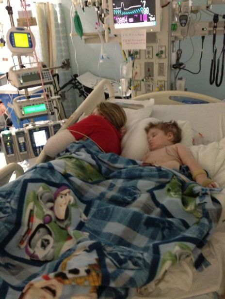 Halstead takes a nap next to Tripp in the ICU in early March.