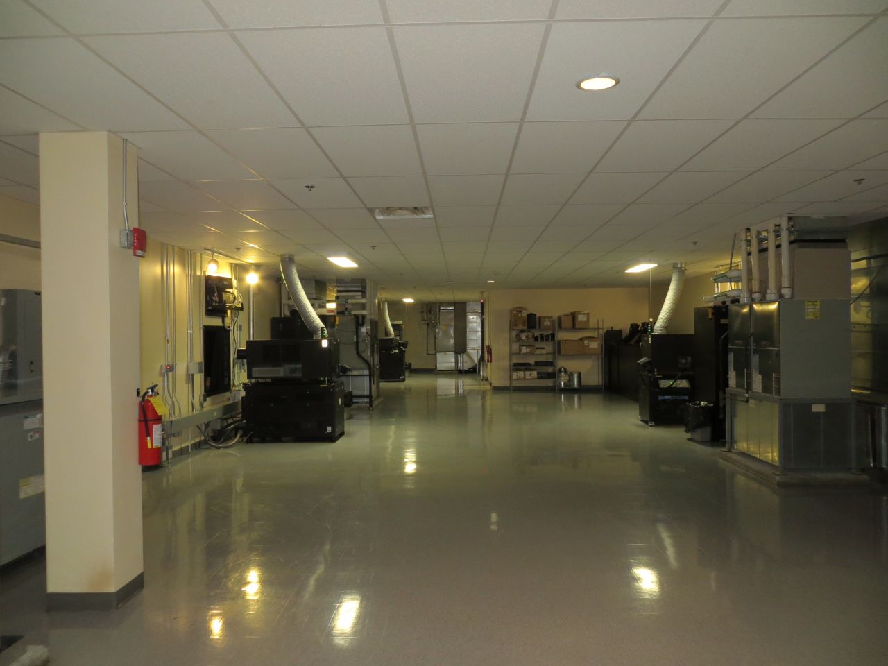 Today, the projection room at many multiplexes, such as Atlanta's Regal Atlantic Station 16 theater, is a wide corridor featuring digital projectors (large black boxes, like the one on the left) and servers.
