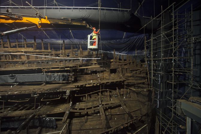 Conservators work on the remains of the Mary Rose at the new Mary Rose Museum at Portsmouth's Historic Dockyard on May 16, 2013 in Portsmouth, England.