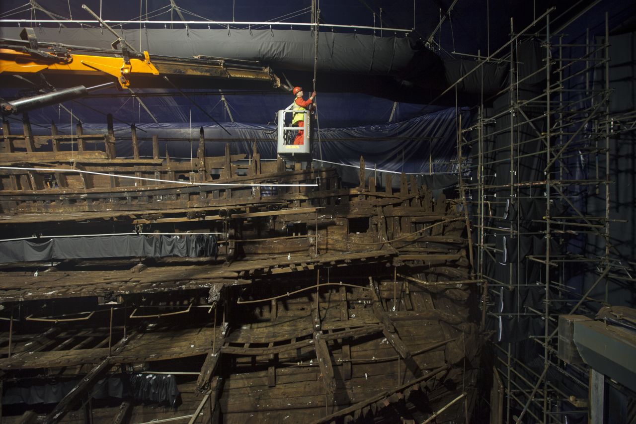 Conservators work on the remains of the Mary Rose at the new Mary Rose Museum at Portsmouth's Historic Dockyard on May 16, 2013 in Portsmouth, England.
