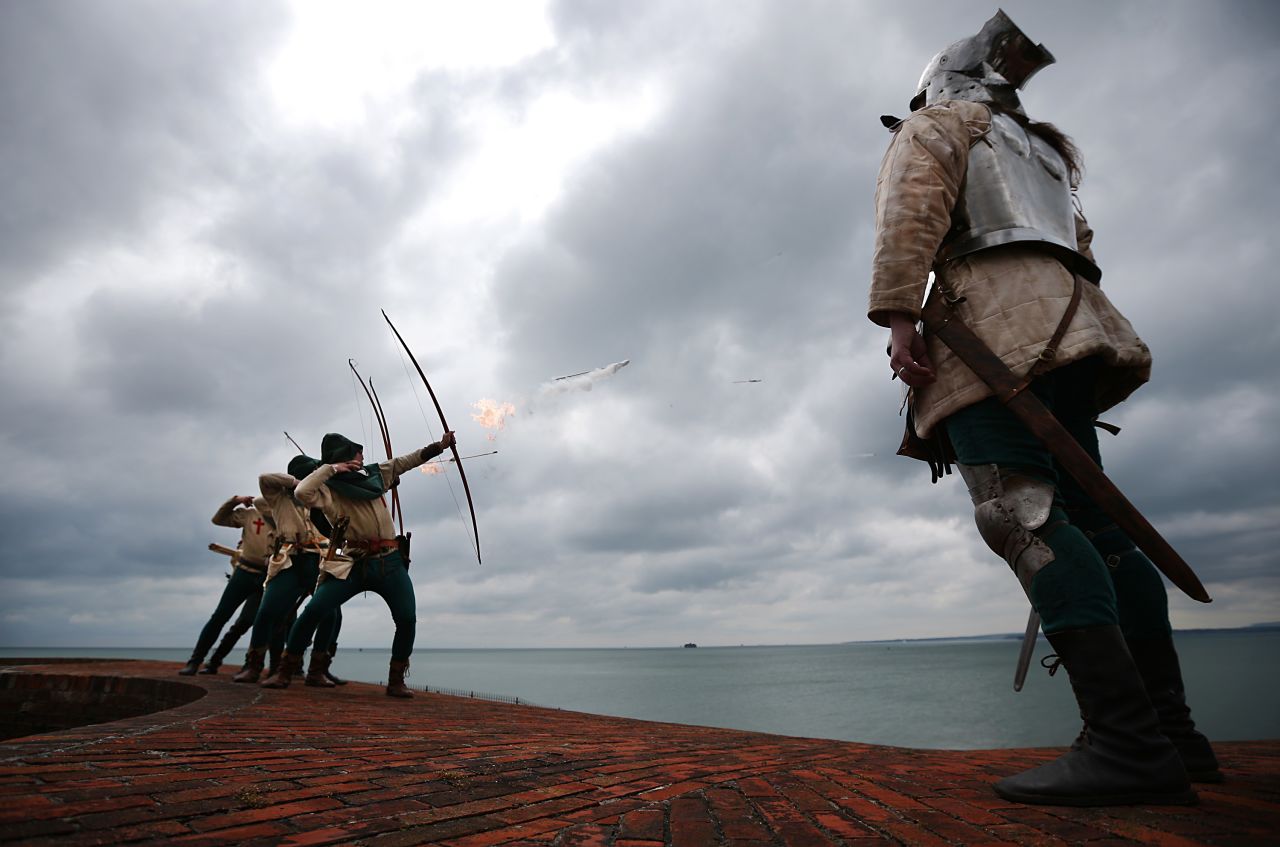 Purbrook Bowmen fire a volley of flaming arrows from Southsea Castle as part of a day of events to mark the opening of the Mary Rose Museum on May 30, 2013 in Portsmouth, England.