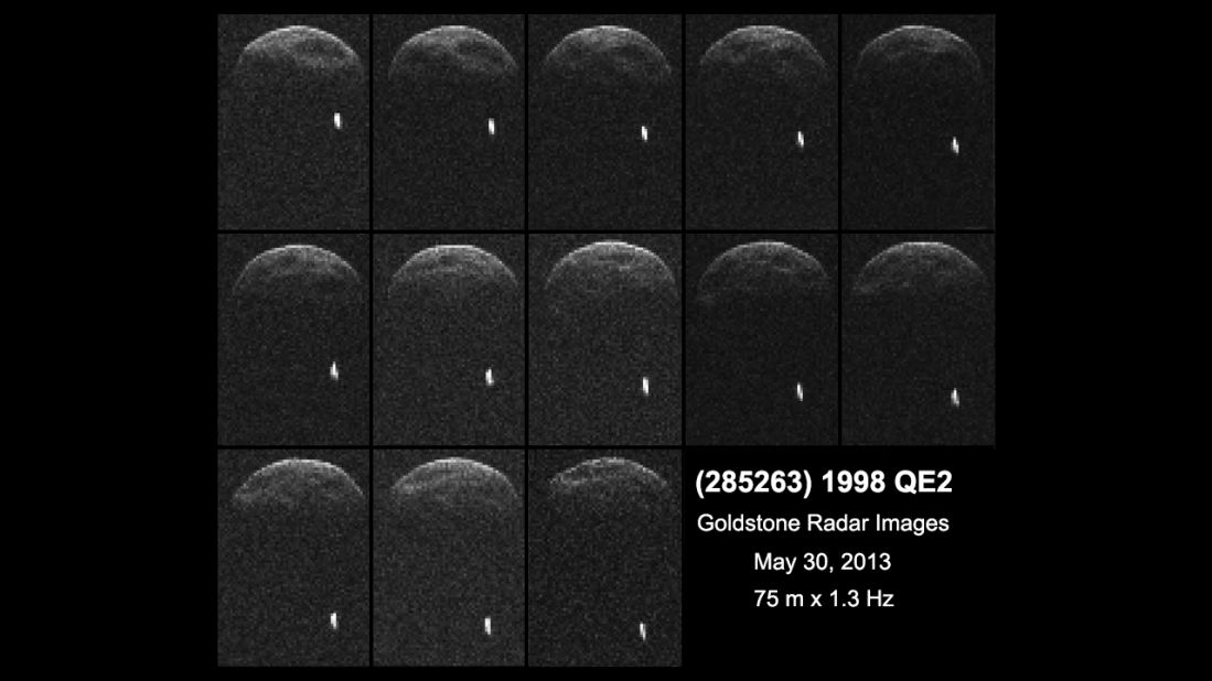 Asteroid 1998 QE2 is about 3.75 million miles from Earth. The white dot is the moon, or satellite, orbiting the asteroid.