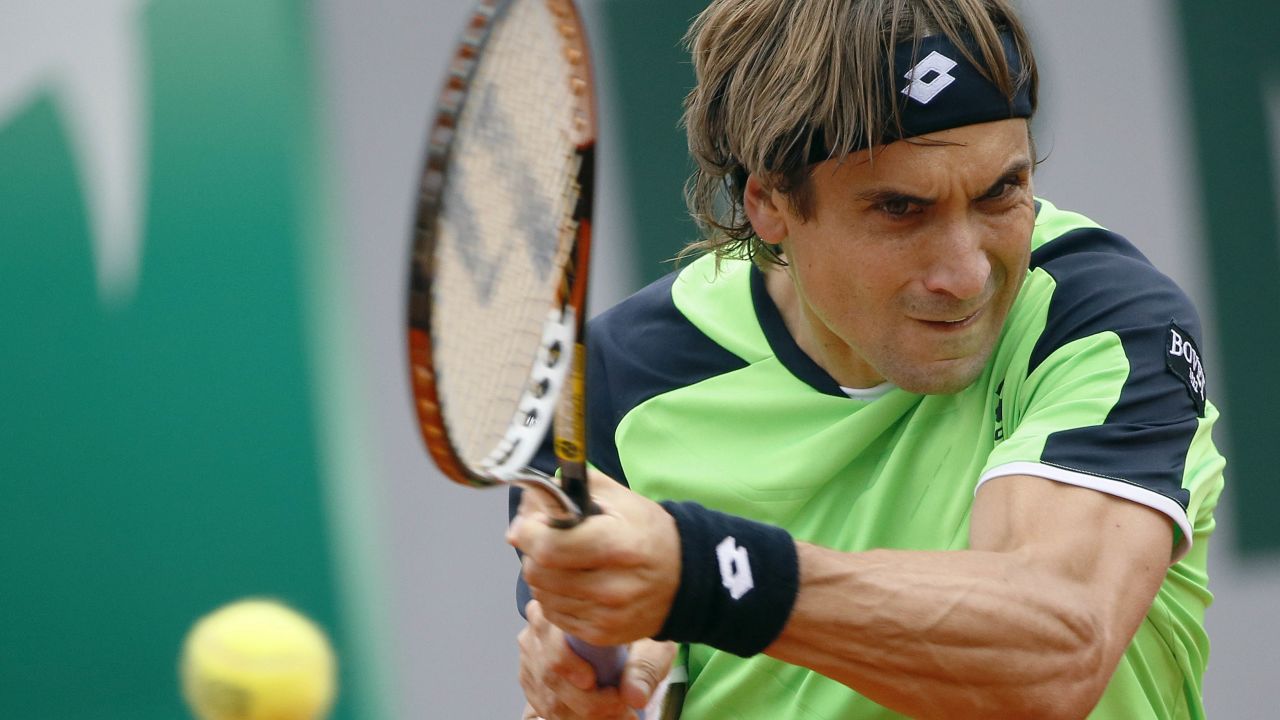 Spain's David Ferrer returns to his countryman Feliciano Lopez on May 31.