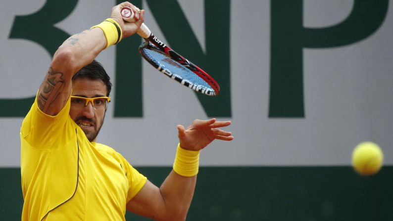 Serbia's Janko Tipsarevic hits a return to Spain's Fernando Verdasco on May 31.