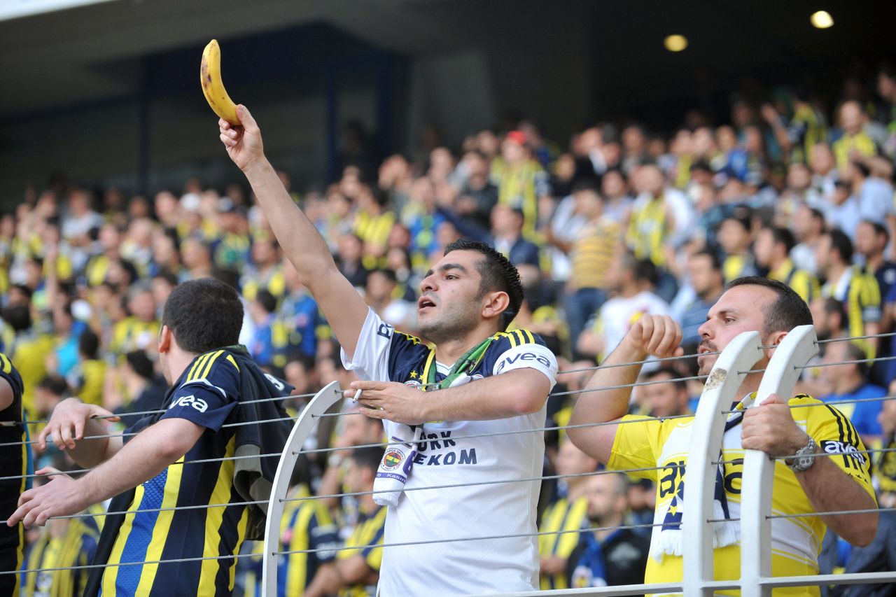 Racism has long been a stain on football but a resurgence of incidents in recent years has prompted soccer's authorities to launch a renewed bid to rid the game of discrimination for good. Here a Fenerbahce fan holds a banana towards Galatasaray's Ivory Coast striker Didier Drogba during a Turkish league match in May 2013.
