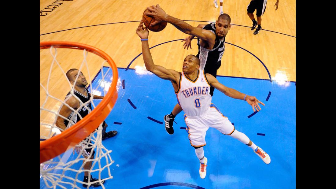 Duncan blocks a shot by the Oklahoma City Thunder's Russell Westbrook during last year's playoffs. Averaging more than two blocks a game throughout his entire career, Duncan has been named to the NBA's All-Defensive first or second teams in 14 of his 16 seasons. 